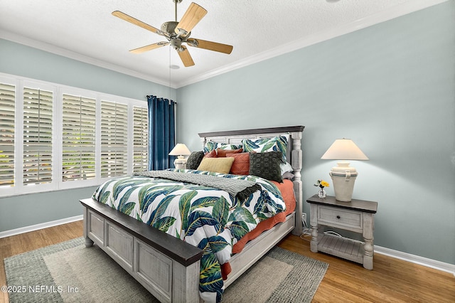 5 Augusta Trl, Palm Coast, FL 32137 - bedroom with wood finished floors, baseboards, ornamental molding, a textured ceiling, and ceiling fan