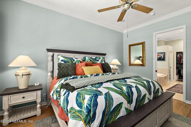 5 Augusta Trl, Palm Coast, FL 32137 - bedroom with crown molding, wood finished floors, connected bathroom, a ceiling fan, and baseboards