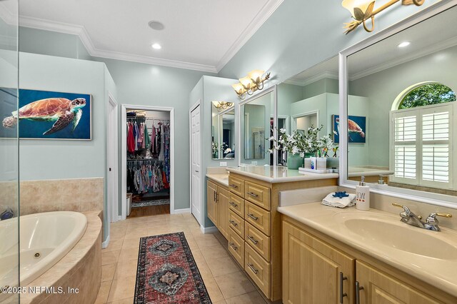 5 Augusta Trl, Palm Coast, FL 32137 - full bath featuring a jetted tub, vanity, tile patterned flooring, ornamental molding, and a walk in closet