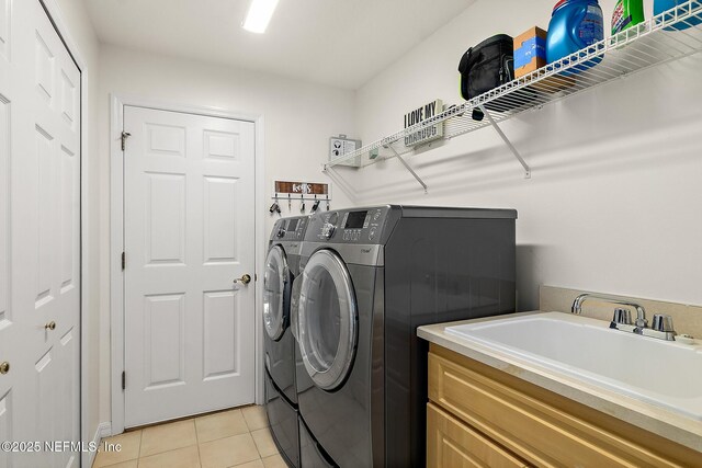 5 Augusta Trl, Palm Coast, FL 32137 - laundry area featuring washer and dryer and light tile patterned floors