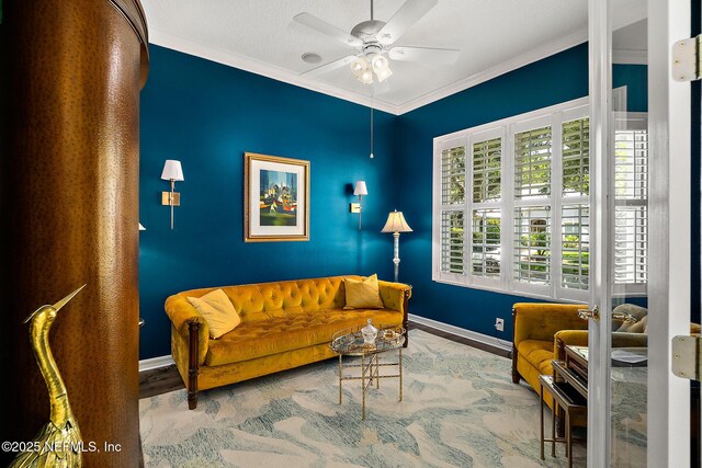 5 Augusta Trl, Palm Coast, FL 32137 - living area with ornamental molding, baseboards, a ceiling fan, and wood finished floors