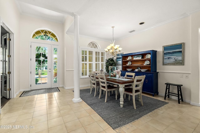 5 Augusta Trl, Palm Coast, FL 32137 - dining space featuring a chandelier, crown molding, light tile patterned floors, and baseboards