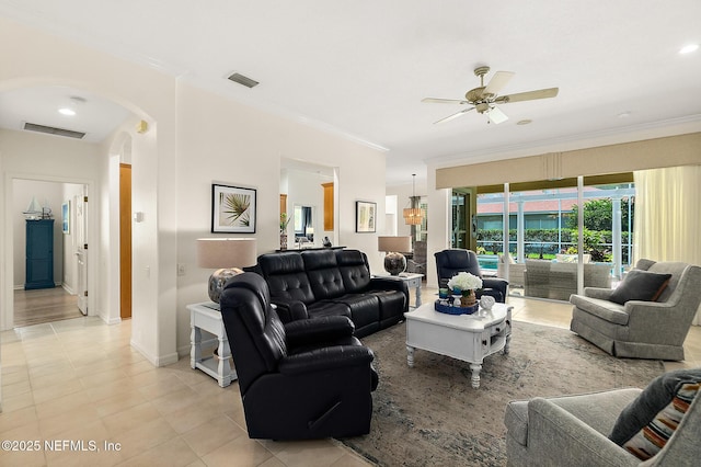 5 Augusta Trl, Palm Coast, FL 32137 - living area with crown molding, a ceiling fan, arched walkways, light tile patterned flooring, and baseboards