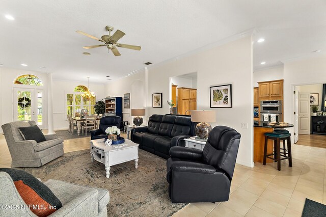 5 Augusta Trl, Palm Coast, FL 32137 - living area with a ceiling fan, light tile patterned floors, crown molding, recessed lighting, and a chandelier