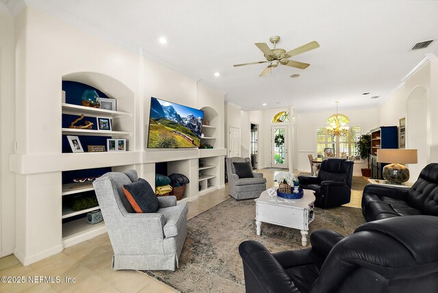 5 Augusta Trl, Palm Coast, FL 32137 - living room featuring a chandelier, a ceiling fan, built in shelves, crown molding, and tile patterned flooring