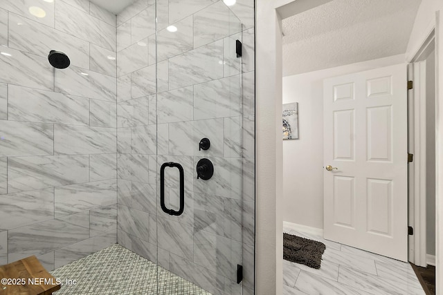 5 Augusta Trl, Palm Coast, FL 32137 - bathroom featuring marble look tile flooring, a shower stall, and baseboards