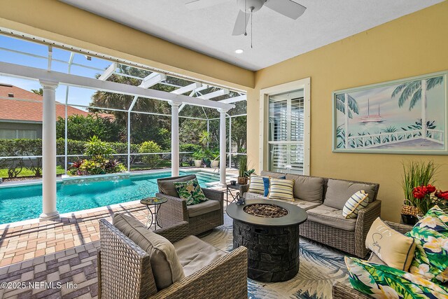 5 Augusta Trl, Palm Coast, FL 32137 - swimming pool featuring an outdoor living space with a fire pit, a patio area, ceiling fan, and a lanai