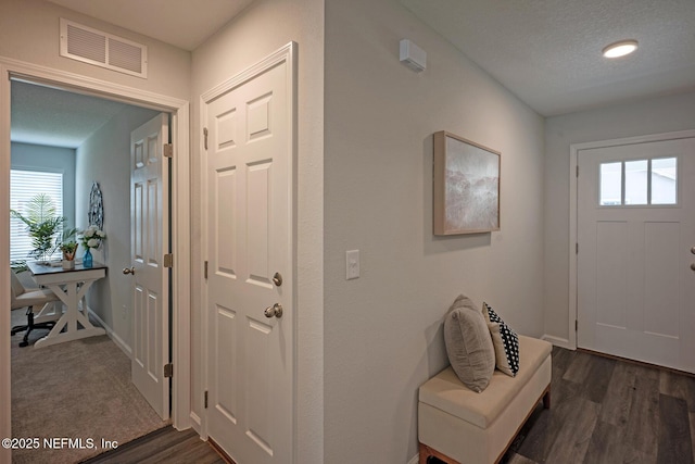 12252 Lyons St, Jacksonville, FL 32224 - entryway featuring plenty of natural light, dark wood-type flooring, and baseboards