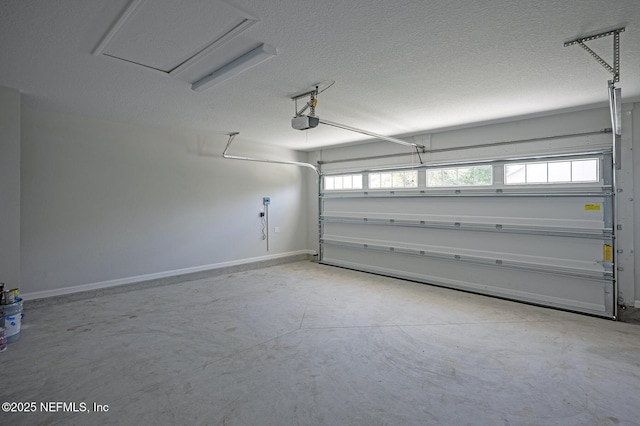 12252 Lyons St, Jacksonville, FL 32224 - garage with a garage door opener and baseboards