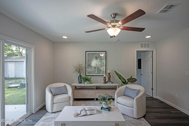12252 Lyons St, Jacksonville, FL 32224 - living room with wood finished floors, a ceiling fan, baseboards, a textured ceiling, and recessed lighting