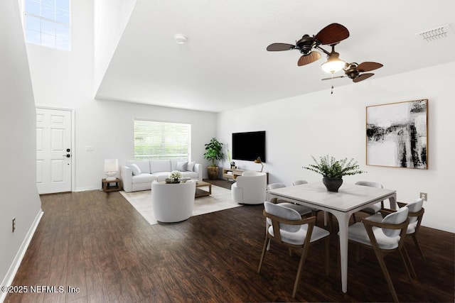 65074 Mossy Creek Ln, Yulee, FL 32097 - dining room with wood finished floors, a ceiling fan, and baseboards