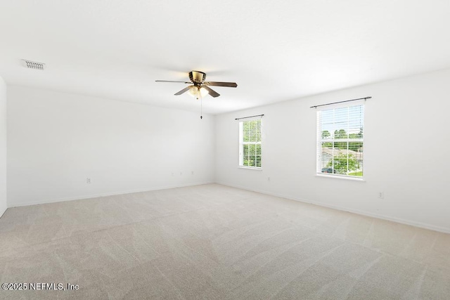 65074 Mossy Creek Ln, Yulee, FL 32097 - unfurnished room featuring a ceiling fan, light colored carpet, and baseboards
