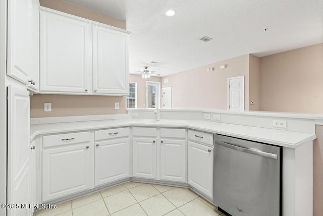 11251 Campfield Dr Unit 4107, Jacksonville, FL 32256 - kitchen featuring stainless steel dishwasher, ceiling fan, a peninsula, light countertops, and white cabinets