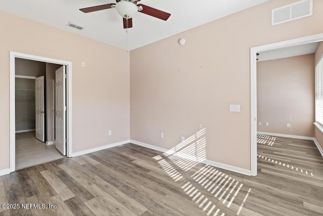 11251 Campfield Dr Unit 4107, Jacksonville, FL 32256 - spare room featuring a ceiling fan, wood finished floors, and baseboards