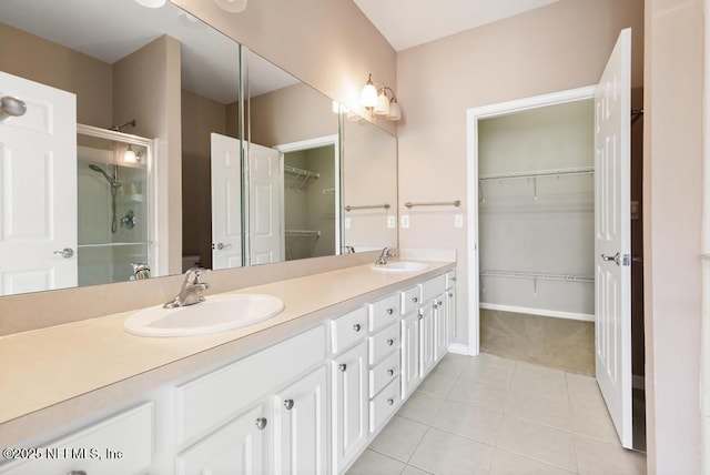 11251 Campfield Dr Unit 4107, Jacksonville, FL 32256 - full bath with a spacious closet, tile patterned flooring, a shower stall, double vanity, and baseboards