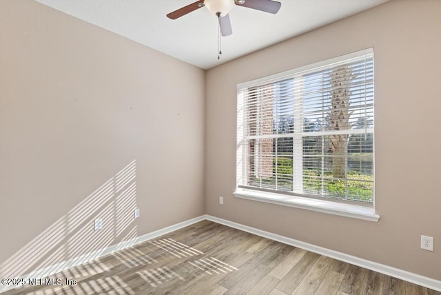 11251 Campfield Dr Unit 4107, Jacksonville, FL 32256 - spare room featuring baseboards, wood finished floors, and ceiling fan