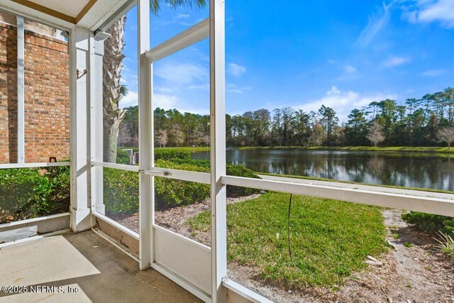 11251 Campfield Dr Unit 4107, Jacksonville, FL 32256 - unfurnished sunroom featuring a water view, view of scattered trees, and healthy amount of natural light