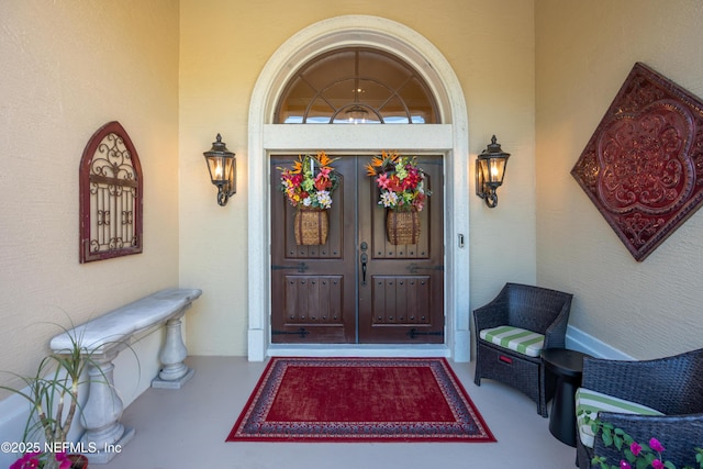 8 Rue Renoir, Palm Coast, FL 32137 - property entrance with stucco siding and a porch