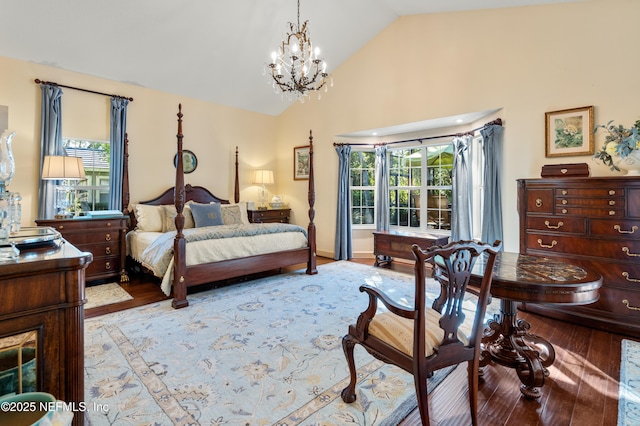 8 Rue Renoir, Palm Coast, FL 32137 - bedroom featuring wood finished floors, high vaulted ceiling, and a chandelier
