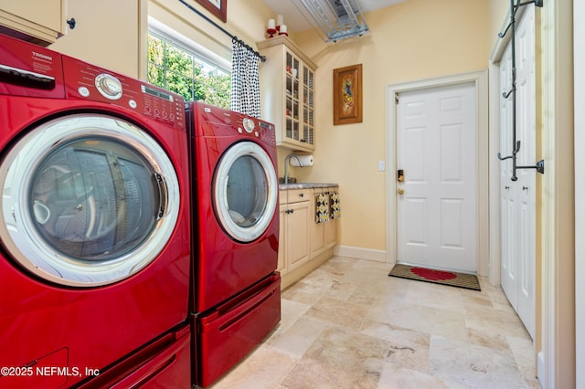 8 Rue Renoir, Palm Coast, FL 32137 - washroom with washer and clothes dryer, cabinet space, and light stone finish flooring