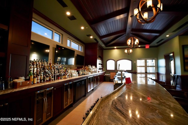 8 Rue Renoir, Palm Coast, FL 32137 - indoor dry bar with a chandelier, high vaulted ceiling, wooden ceiling with exposed beams, ornamental molding, and pendant lighting