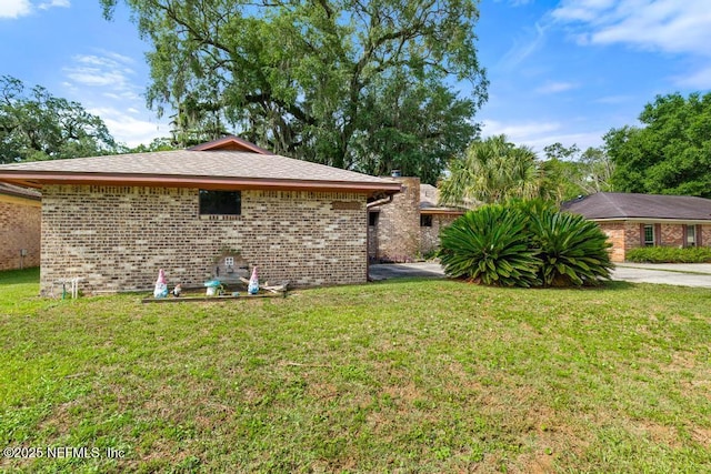 5342 Hickson Rd, Jacksonville, FL 32207 - view of side of property with a lawn and brick siding