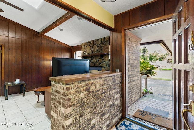 5342 Hickson Rd, Jacksonville, FL 32207 - interior space with wooden walls, vaulted ceiling, and a textured ceiling