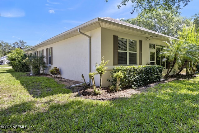 1141 Glengad, Ormond Beach, FL 32174 - view of side of property with stucco siding and a yard