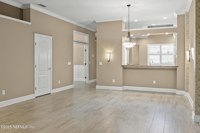 1141 Glengad, Ormond Beach, FL 32174 - unfurnished living room featuring ornamental molding, light wood-type flooring, and recessed lighting