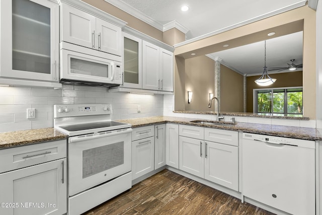1141 Glengad, Ormond Beach, FL 32174 - kitchen with white appliances, ornamental molding, white cabinetry, ceiling fan, and recessed lighting