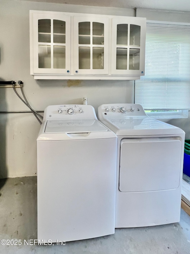 1141 Glengad, Ormond Beach, FL 32174 - washroom with washer and clothes dryer and cabinet space