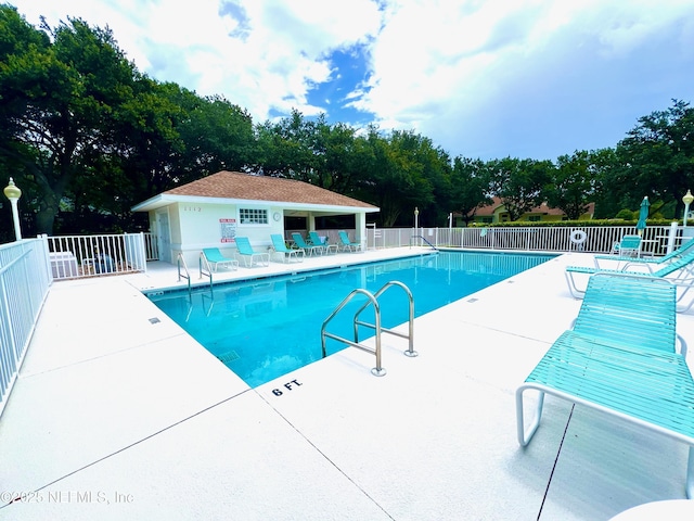 1141 Glengad, Ormond Beach, FL 32174 - community pool with a patio area and view of wooded area