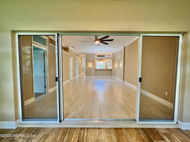 1141 Glengad, Ormond Beach, FL 32174 - unfurnished room featuring crown molding, a ceiling fan, and wood finished floors