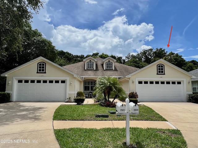 1141 Glengad, Ormond Beach, FL 32174 - view of front of property with a garage, driveway, and stucco siding