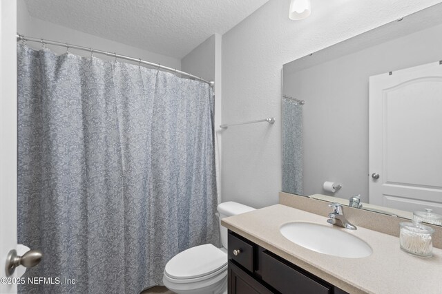 1929 Rock Springs Way, Middleburg, FL 32068 - bathroom with toilet, a textured ceiling, and vanity