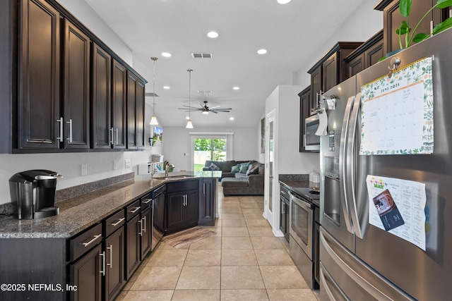 1929 Rock Springs Way, Middleburg, FL 32068 - kitchen featuring stainless steel appliances, a sink, open floor plan, a ceiling fan, and recessed lighting