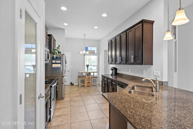1929 Rock Springs Way, Middleburg, FL 32068 - kitchen featuring a sink, appliances with stainless steel finishes, dark brown cabinetry, recessed lighting, and light tile patterned floors
