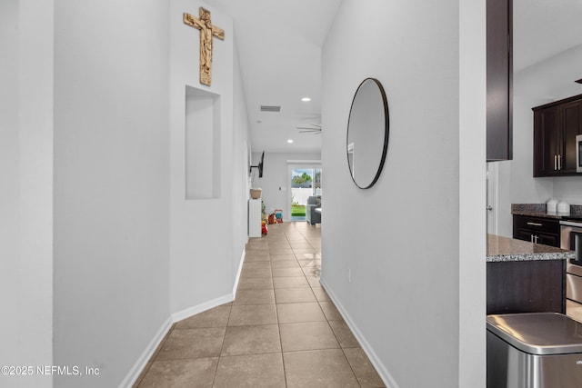 1929 Rock Springs Way, Middleburg, FL 32068 - hallway with light tile patterned flooring, baseboards, and recessed lighting