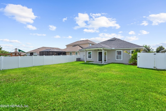 1929 Rock Springs Way, Middleburg, FL 32068 - rear view of house featuring a ceiling fan, stucco siding, a shingled roof, a patio area, and cooling unit
