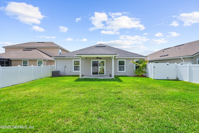 1929 Rock Springs Way, Middleburg, FL 32068 - rear view of property featuring ceiling fan, central AC, stucco siding, and a shingled roof