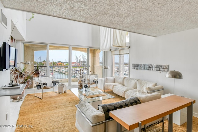 3115 Harbor Dr, Saint Augustine, FL 32084 - living area featuring a water view and a textured ceiling