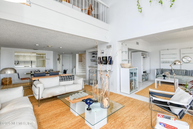 3115 Harbor Dr, Saint Augustine, FL 32084 - living area with stairs and a textured ceiling