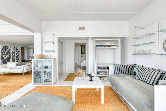 3115 Harbor Dr, Saint Augustine, FL 32084 - living room featuring a textured ceiling