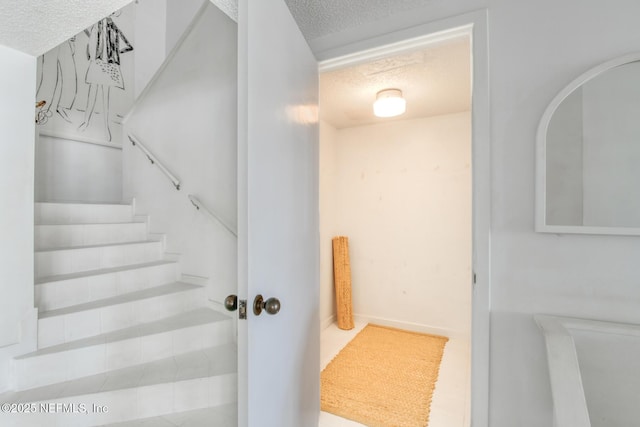 3115 Harbor Dr, Saint Augustine, FL 32084 - staircase with a textured ceiling