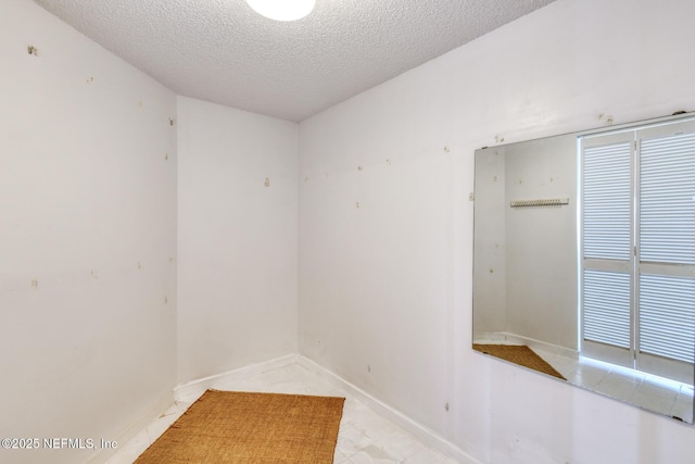 3115 Harbor Dr, Saint Augustine, FL 32084 - empty room with a textured ceiling