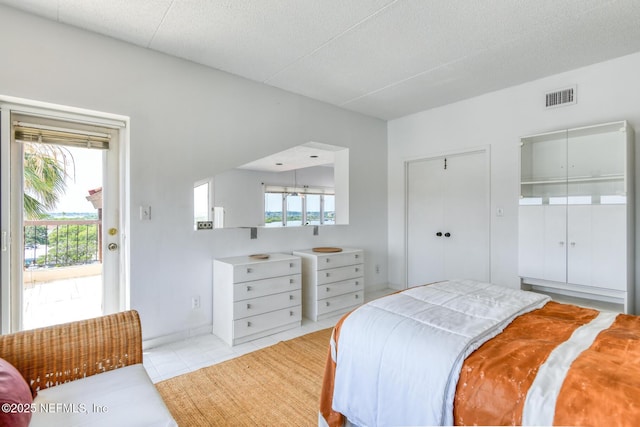 3115 Harbor Dr, Saint Augustine, FL 32084 - bedroom featuring access to exterior and light tile patterned floors