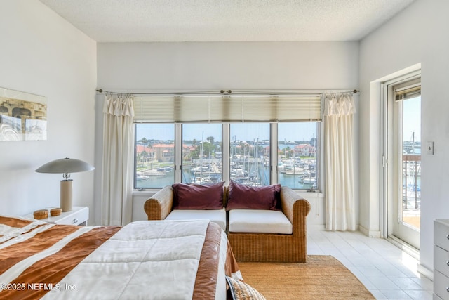 3115 Harbor Dr, Saint Augustine, FL 32084 - bedroom featuring access to outside, a water view, and multiple windows