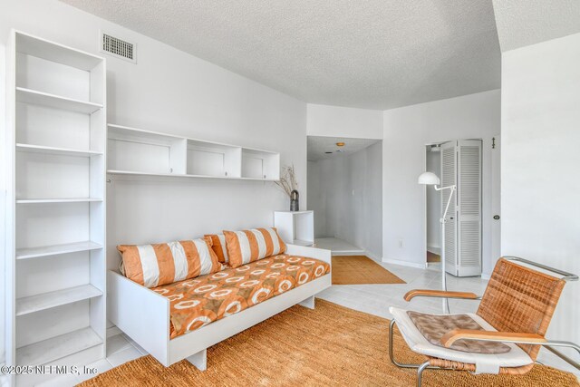 3115 Harbor Dr, Saint Augustine, FL 32084 - living area with a textured ceiling and tile patterned floors