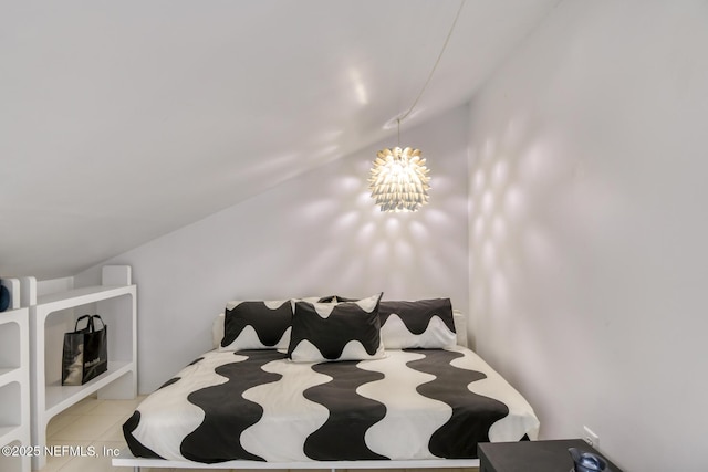 3115 Harbor Dr, Saint Augustine, FL 32084 - bedroom with vaulted ceiling, a chandelier, and tile patterned floors