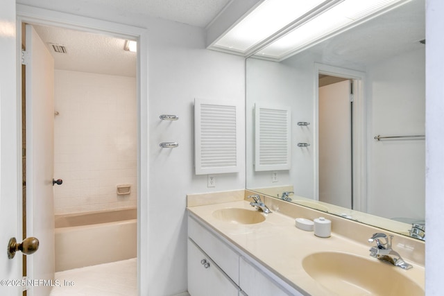 3115 Harbor Dr, Saint Augustine, FL 32084 - full bath featuring double vanity, a textured ceiling, and bathing tub / shower combination